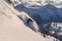 Steep powder skiing on Cowboy Ridge with Castle Towers Mountain in background