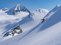 Skier on untouched powder in high alpine