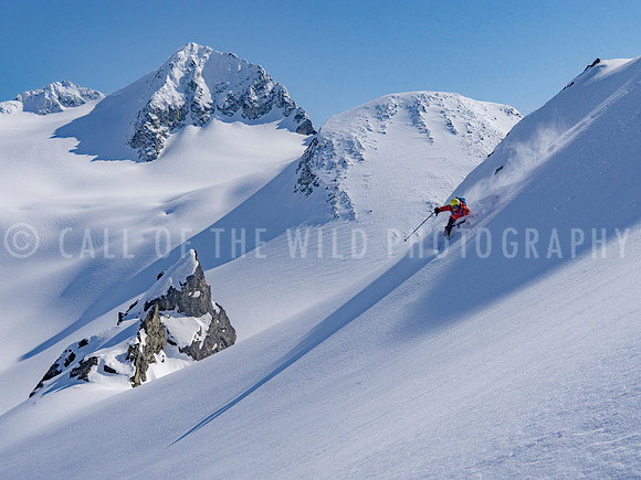 Skier on untouched powder in high alpine
